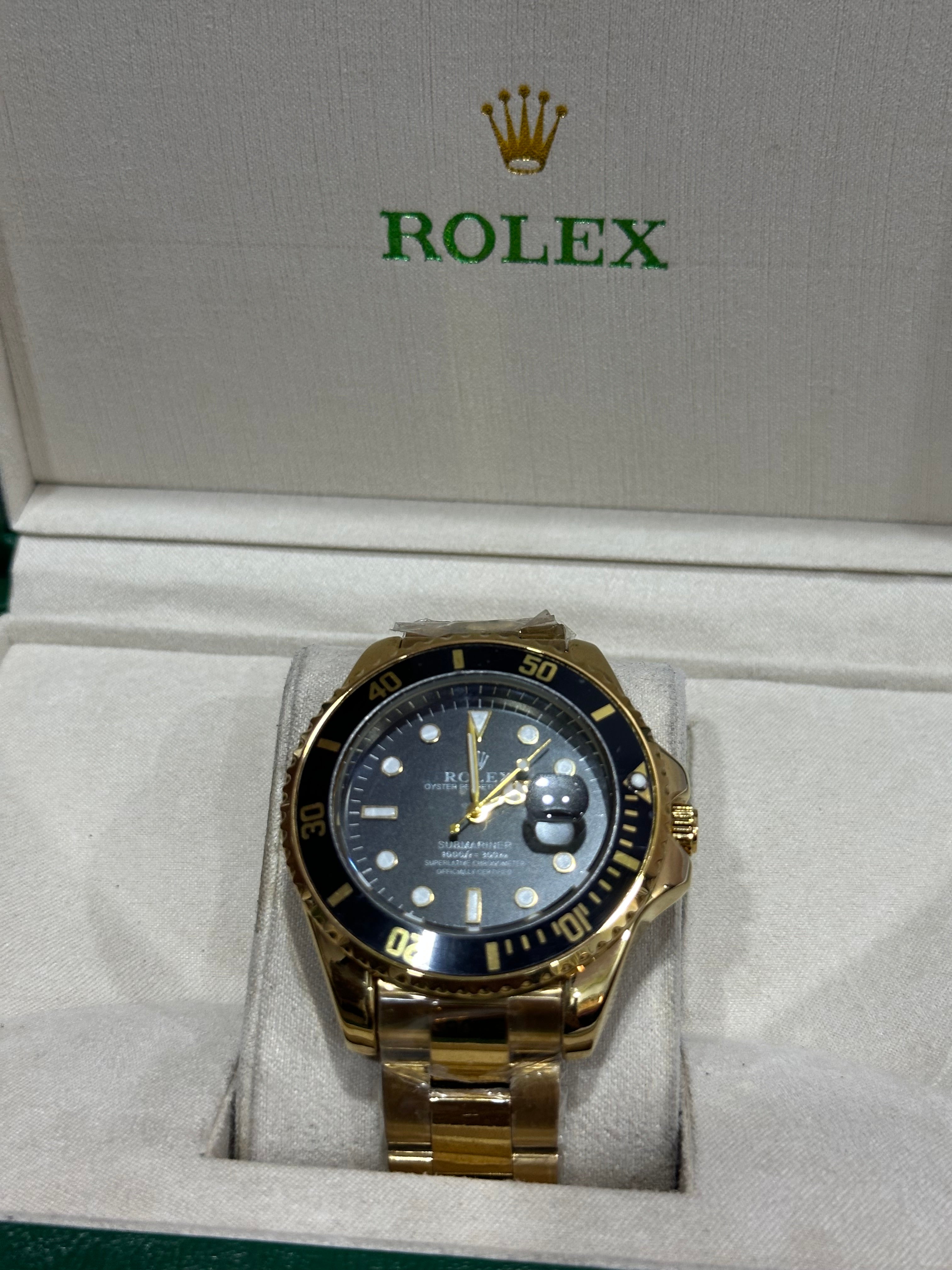 ROLEX WATCH WITH BLACK DIAL AND GOLDEN CHAIN