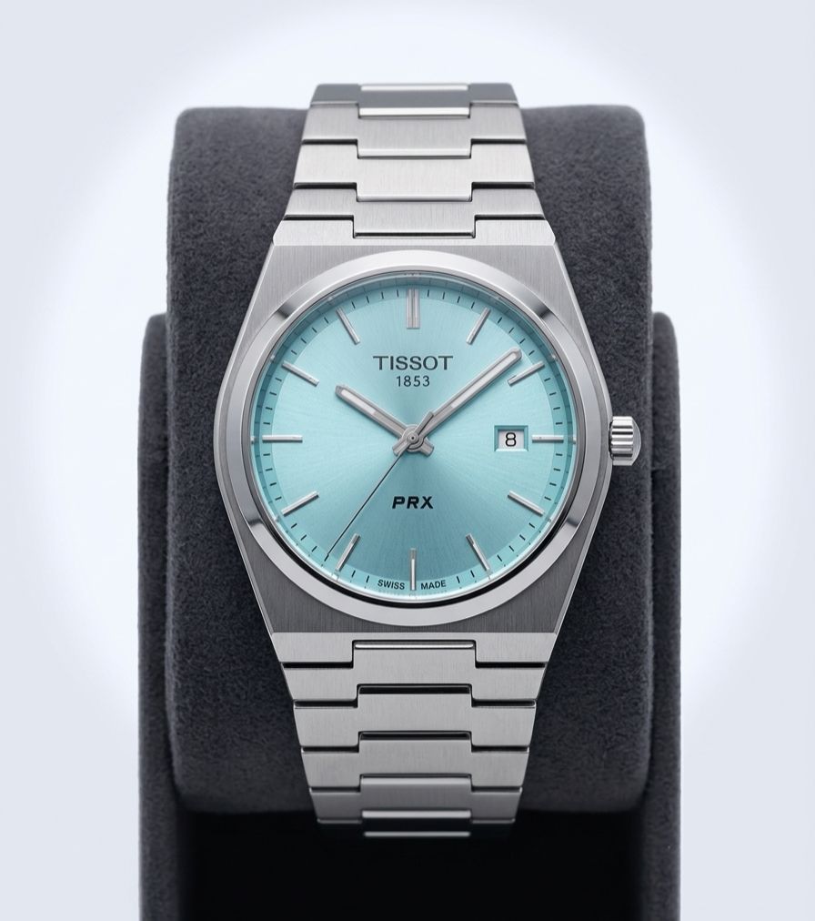 Tissot PRX Stainless Steel Watch, specifically the 35mm model with a light blue or "Tiffany" dial