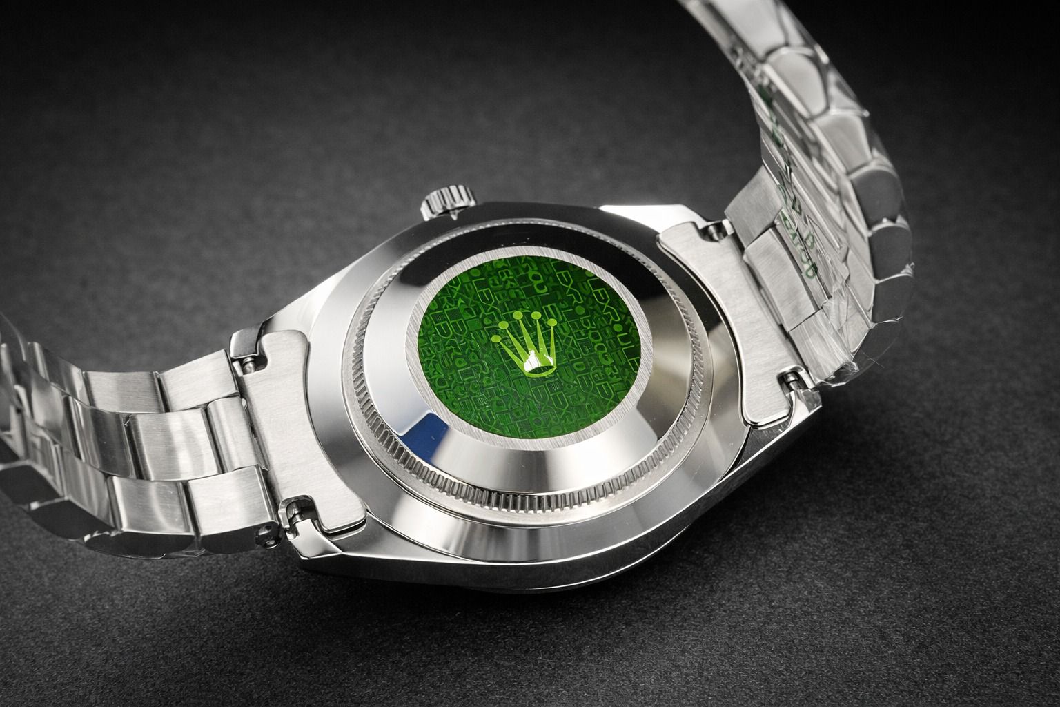 Rolex Day-Date 40 crafted in platinum with a bright black dial and fluted bezel.