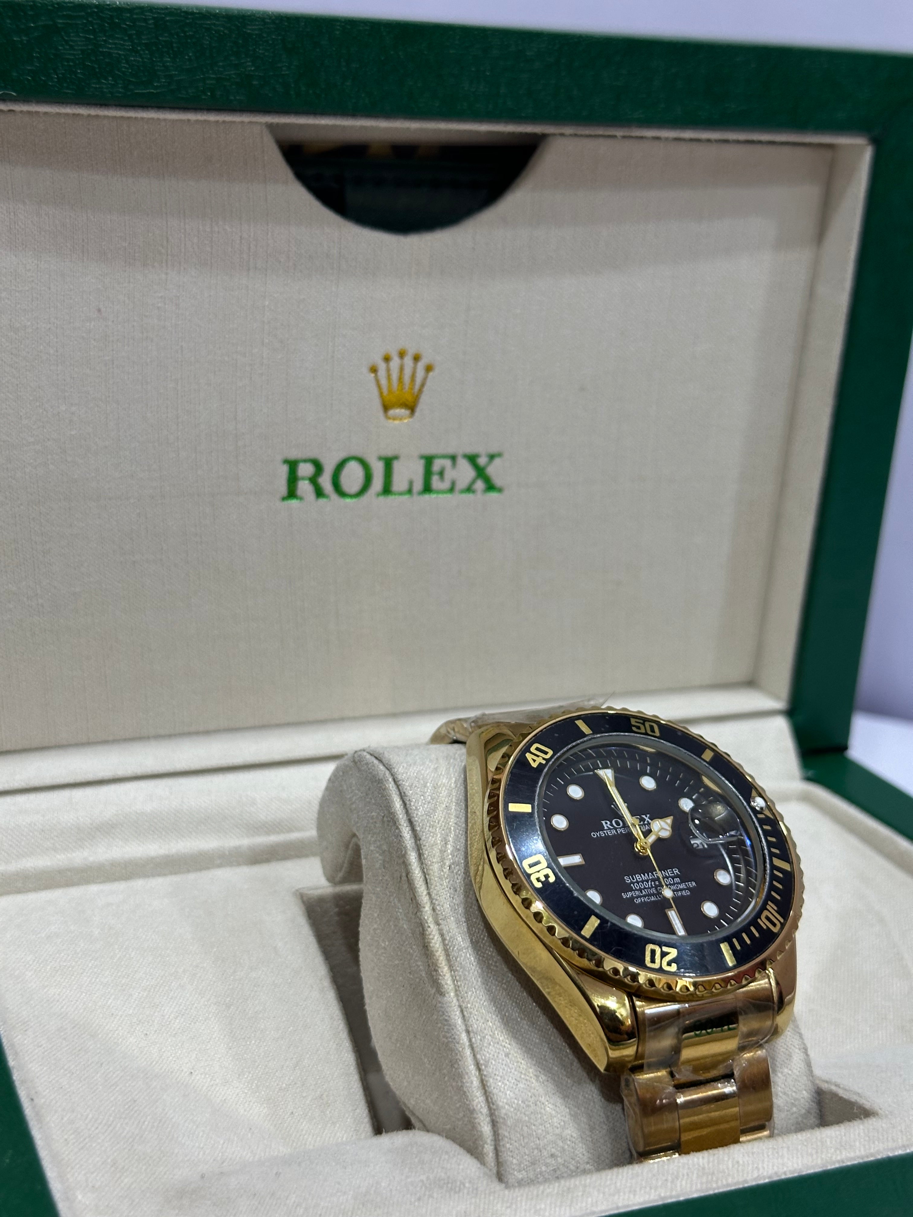 ROLEX WATCH WITH BLACK DIAL AND GOLDEN CHAIN