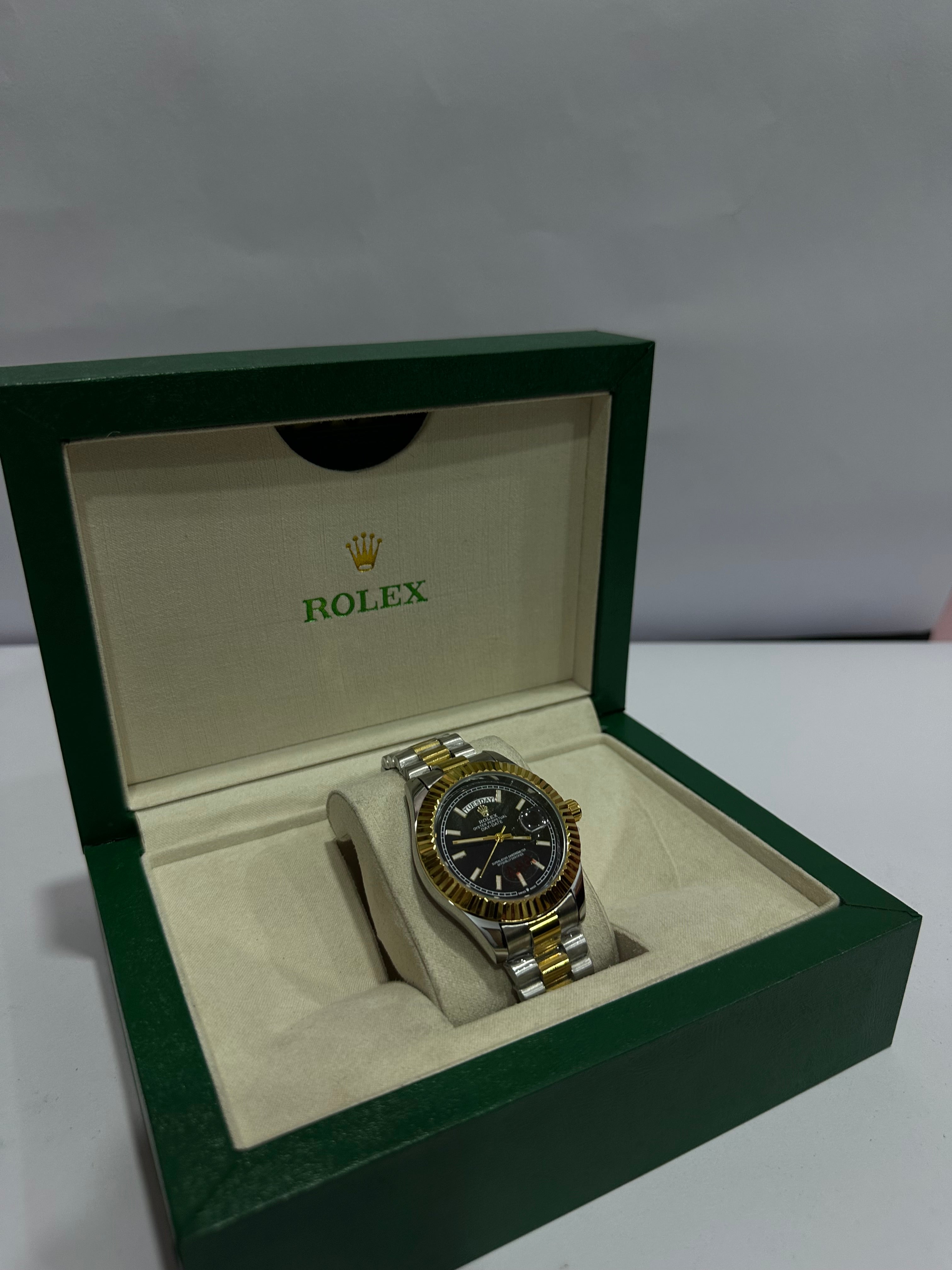 ROLEX WATCH WITH BLACK,GOLDEN DIAL AND SILVER,GOLDEN CHAIN