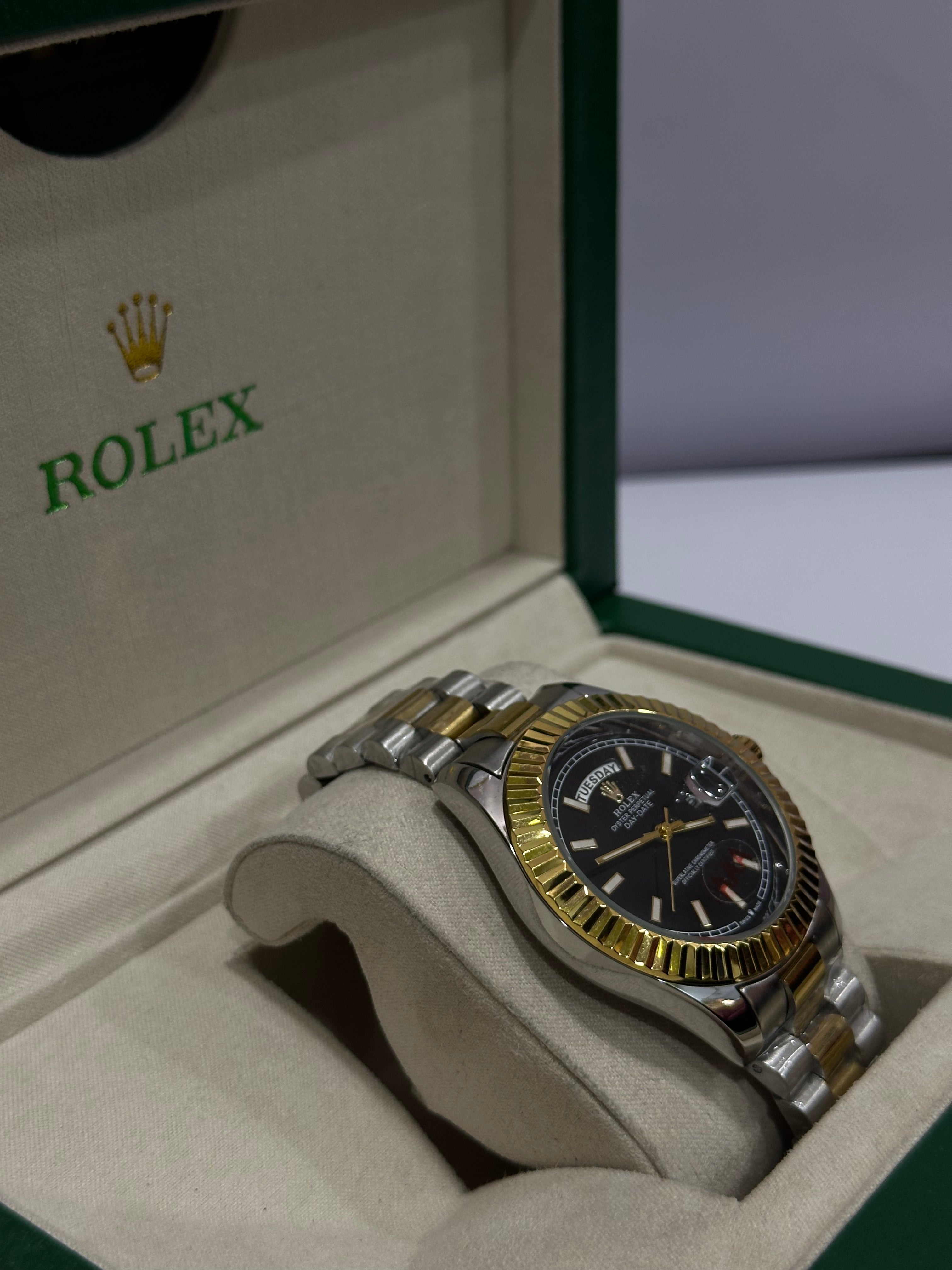 ROLEX WATCH WITH BLACK,GOLDEN DIAL AND SILVER,GOLDEN CHAIN